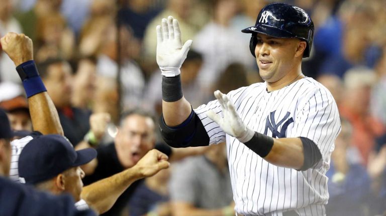 Carlos Beltran #36 of the Yankees celebrates his sixth inning grand slam against the Cleveland Indians at Yankee Stadium on Friday, August 8, 2014 in the Bronx Borough of New York City.