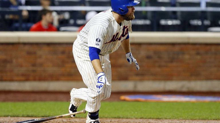 Lucas Duda of the Mets follows through on a fourth-inning base hit against the Washington Nationals at Citi Field on Wednesday, Aug. 13, 2014.
