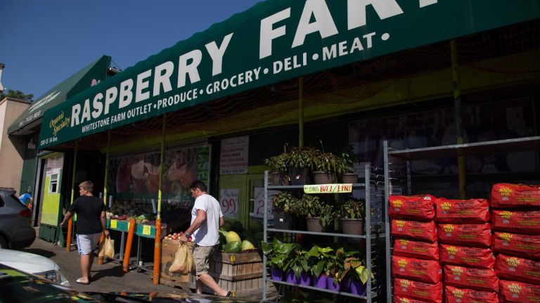 Residents shop at Raspberry Farm grocery store in Whitestone on August 27, 2014. 
