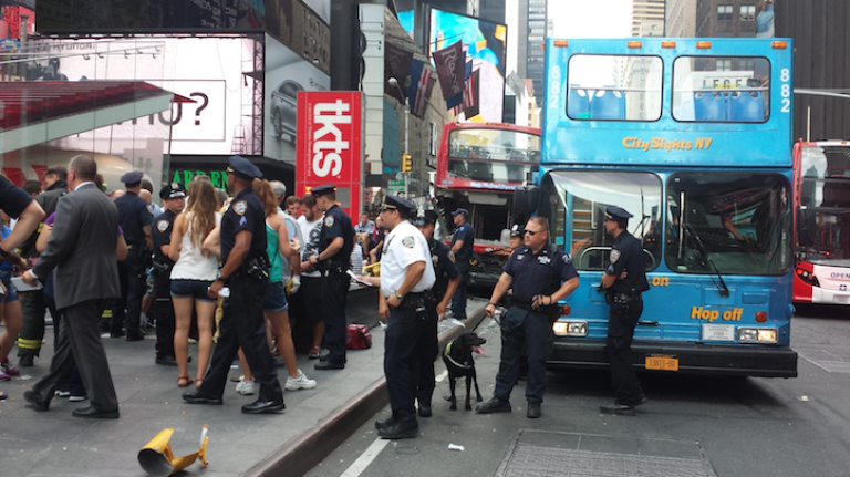 Debris is seen on the ground in Times Square after two tour buses collided.