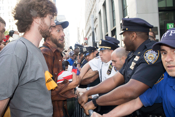 Climate change protesters hit Wall Street 2 Downtown Express photos by Zach Williams About 100 environmentalist demonstrators were arrested Downtown Monday, the day after the larger climate change rally in Midtown.