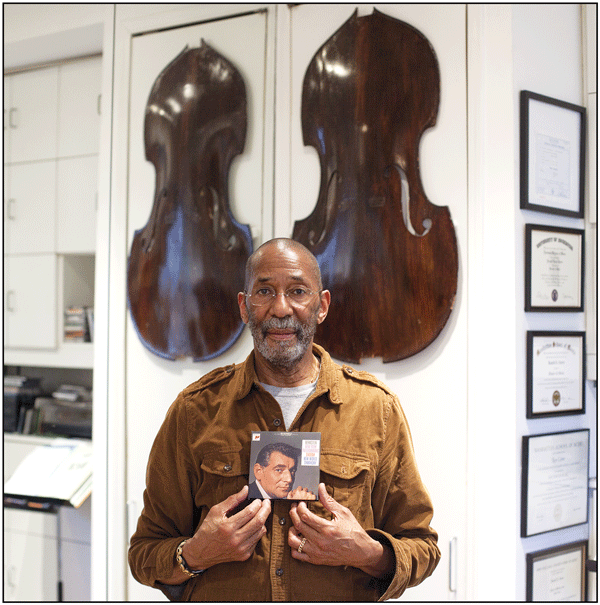 © William Ellis Ron Carter, with his copy of Leonard Bernstein & The NY Philharmonic’s recording of Dvorak’s “New World Symphony.”