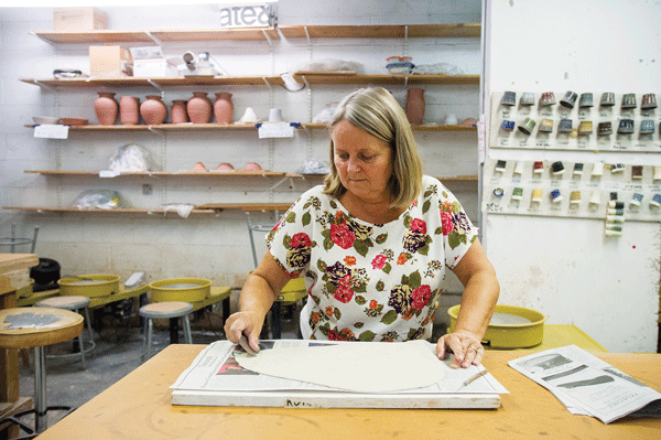 Community Activities, Sept. 11, 2014 2 © Frances M. Roberts At The Penn South Ceramics Studio, Hanne Kjeldgaard prepares a slab of porcelain clay to hand-build bowls. Classes begin the week of Sept. 15.