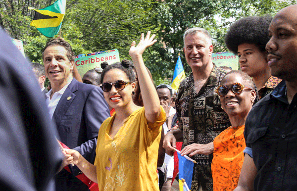 Governor Cuomo, left, marched on Eastern Parkway Monday with Mayor de Blasio, Chirlane McCray and their children, Dante and Chiara, at the West Indian Day Parade. His challenger Zephyr Teachout was also there.   Photo by Tequila Minsky