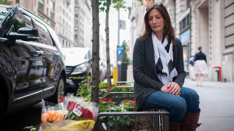 No closure after arrest for Union Sq. hit-and-run victim's GF 2 Jen Kosakowski, 33, girlfriend of Doohee Cho, sits outside of her boyfriends apartment where a memorial of candles and flowers were left by Cho's parents.