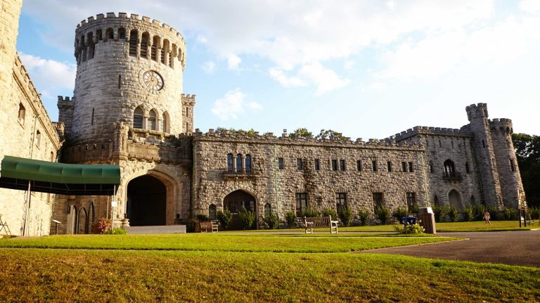 The end of the day casts gold light on Castle Gould at Sands Point Preserve in Port Washington. The estate also has six trails for hiking and viewing fall foliage.