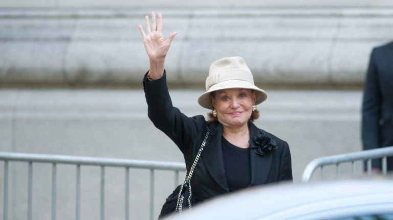 Barbara Walters waves as she arrives at Temple Emanu-El in Manhattan before a private funeral for Joan Rivers on Sunday, Sept. 7, 2014.