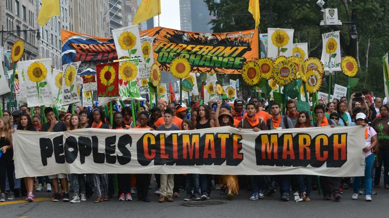 Burned up by self-righteous environmentalists 2 Participants in the People's Climate March walk south on Avenue of the Americas in Manhattan on Sunday, Sept. 21, 2014.