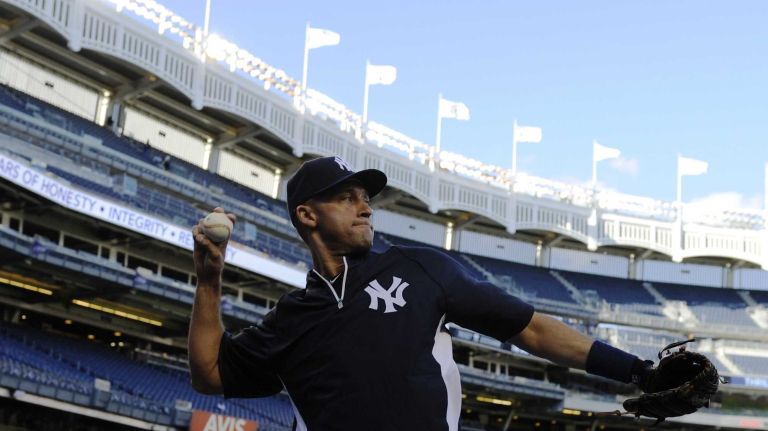 New York Yankees shortstop Derek Jeter throws during batting practice before a baseball game against the Baltimore Orioles at Yankee Stadium on Monday, September 22, 2014.