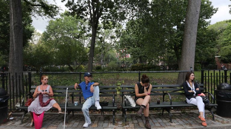 A park bench in the afternoon in Tompkins Square Park.