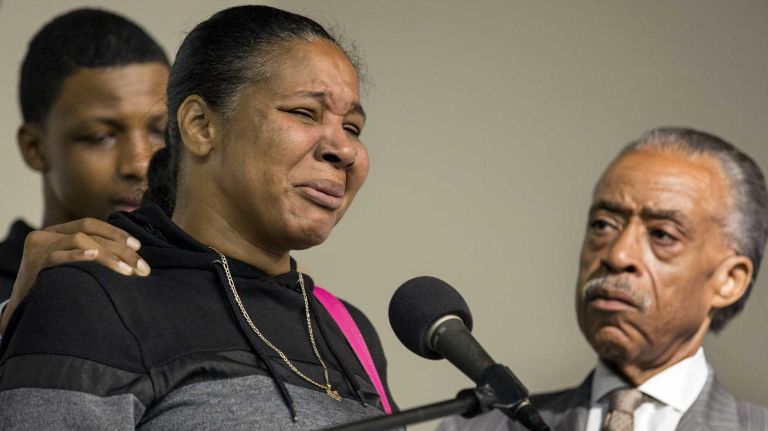 Esaw Garner, wife of chokehold victim Eric Garner, speaks about her husband and his 44th birthday with other family members and the Rev. Al Sharpton at the National Action Network in Harlem Saturday, Sept. 13, 2014.