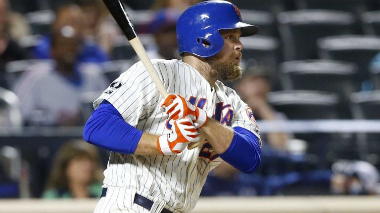 Lucas Duda #21 of the Mets follows through on a fifth-inning two-run base hit against the Miami Marlins at Citi Field on Wednesday, Sept. 17, 2014.