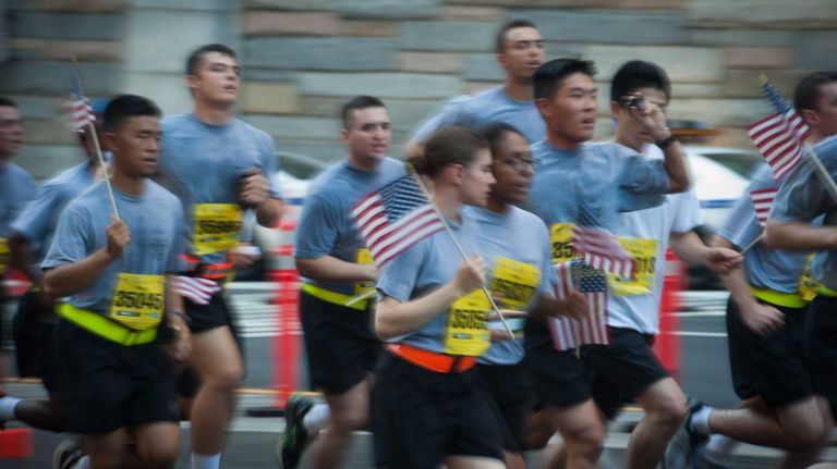 Army members exit the Hugh L. Carey Tunnel on Sunday, Sept. 28, 2014, during the annual Stephen Siller Tunnel To Towers 5K Run & Walk that honored fallen 9/11 heroes, .