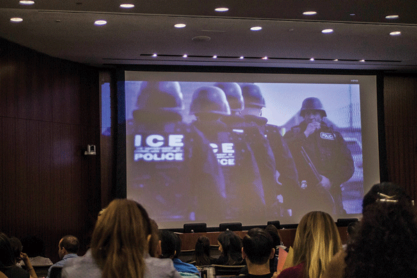 At the Aug. 22 lawyers’ seminar, an image was shown of officers from U.S. Immigration and Customs Enforcement, which is responsible for deportations.  Photo by Zach Williams