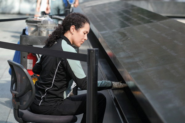 Downtown Express photo by Milo Hess A visitor to the 9/11 Memorial this week. 