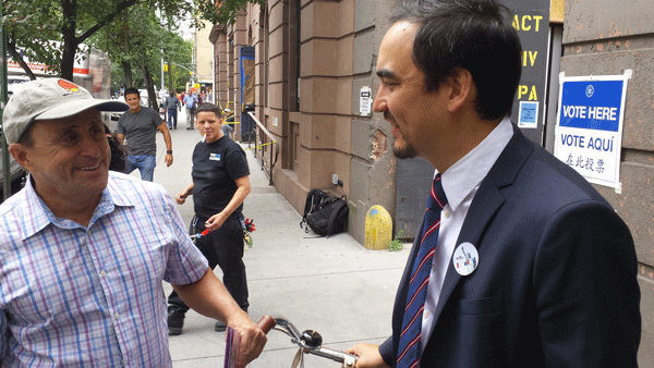 Tim Wu, right, spoke with Allen Roskoff, a prominent early supported of the Teachout-Wu ticket, outside the L.G.B.T. Center on Tuesday.    Photo by Lincoln Anderson