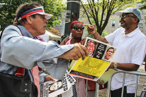 Stand-up comic Randy Credico, who is also on the Democratic ballot for governor, handed out fliers at the West Indian Day Parade.   Photo by Tequila Minsky