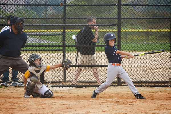 Nathan Economou, the Villagers’ second baseman, ripping a hit.