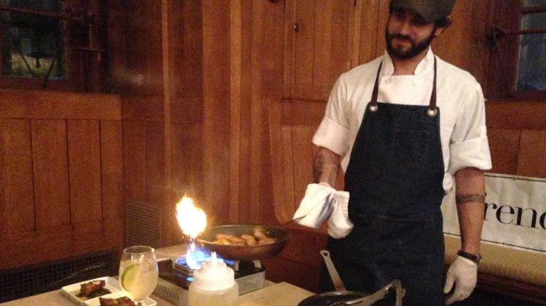 Staten Island's Snug Harbor rebranding itself as foodie destination 2 Ian Alvarez, chef de cuisine at French Louie in Brooklyn, prepares spicy lamb merguez sausages to be paired with eggplant and walnut mousse using Snug Harbor's produce.