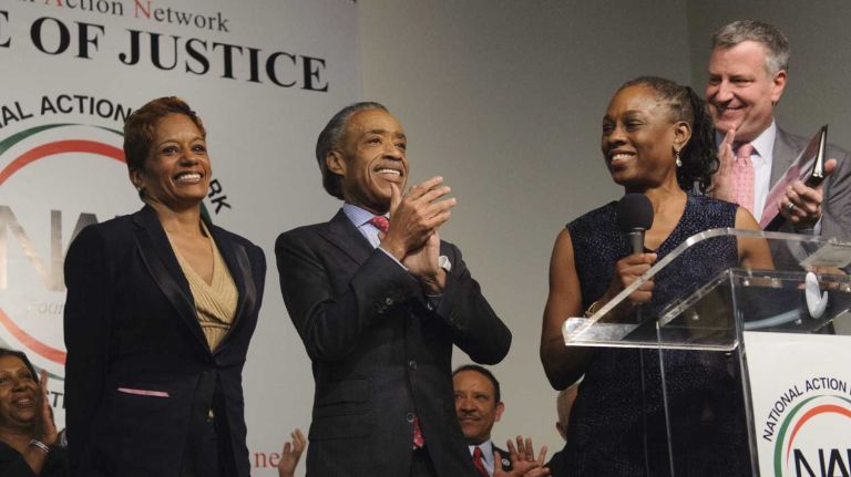 Rachel Noerdlinger is applauded by the Rev. Al Sharpton, Chirlane McCray, and Mayor Bill de Blasio, as it is announced that Noerdlinger will serve as Chief of Staff to the McCray, during the National Action Network's Annual King Day Public Policy Forum on Monday in Manhattan on Jan. 20, 2014.