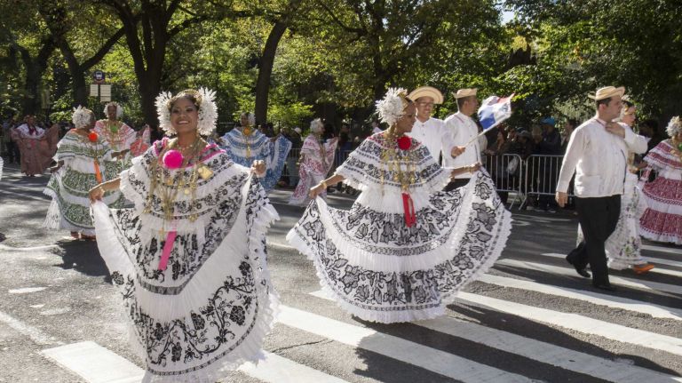 Participants walk in the 50th annual Hispanic Day Parade on 5th Avenue between 44th to 67th streets in Manhattan on Sunday, Oct. 12, 2014.