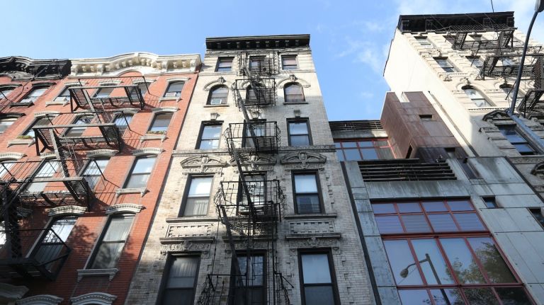 According to reports in December 2014, the average price of a condo or co-op in Manhattan is $1.8 million. These buildings are long First Street between First and Second avenues in the East Village on Sept. 10,  2014.