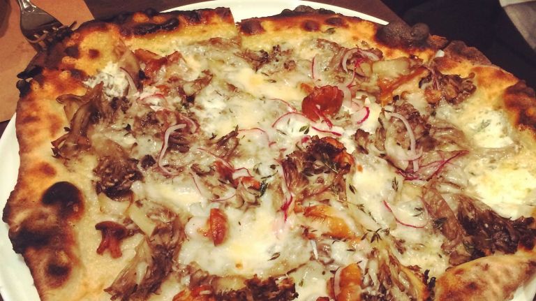 Marta is putting tripe on its pizza 2 Marta makes Roman-inspired pizzas at the Martha Washington Hotel. Here's a fancy funghi topped pie.