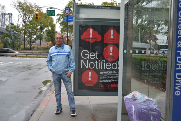 Joseph Hanania standing at the end of the line: the M14A bus stop at the east end of Grand St.   Photo by HANA RASKIN