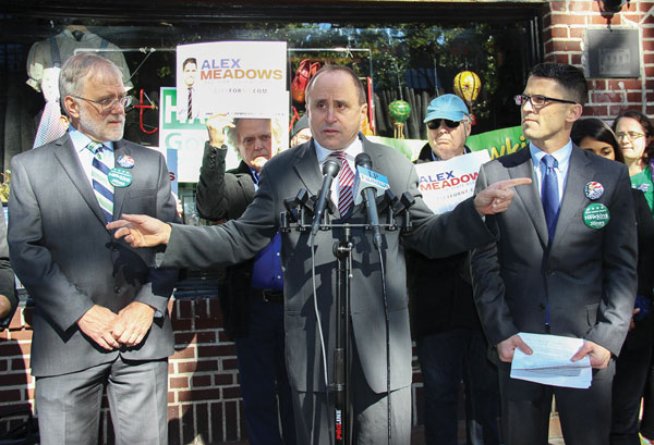 Allen Roskoff, president of the Jim Owles Liberal Democratic Club, center, outside the Stonewall Inn last week, as Howie Hawkins, the Green Party candidate for governor, left, and Alexander Meadows, the local Progressive Party candidate for Assembly, cross-endorsed each other. Photo by Tequila Minsky