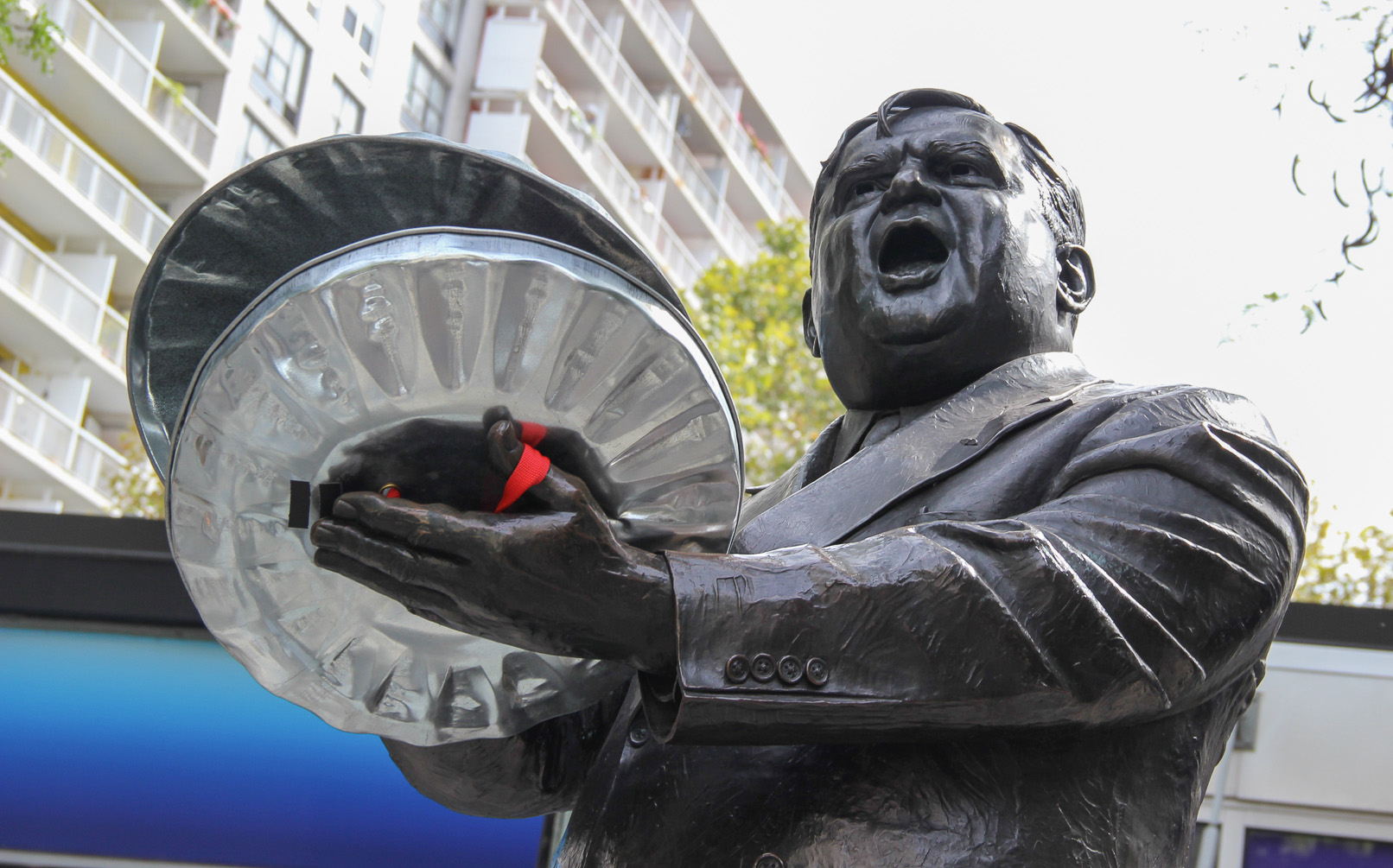 Just a few weeks ago, community opponents of the N.Y.U. expansion plan rallied on LaGuardia Place, calling on the city and N.Y.U. to "Drop the appeal!" of Judge Donna Mills's January ruling. The cast of "STOMP" joined the rally and added garbage can lid cymbals to the  Fiorello LaGuardia statue's clapping hands.  Photo by Tequila Minsky