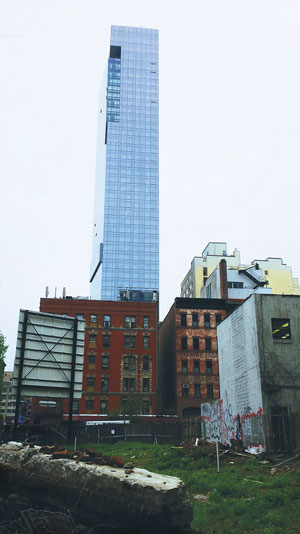 The Trump Soho Condo-Hotel towers over Hudson Square.  Villager photo