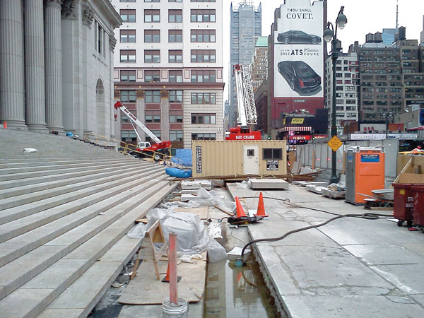 A Late Arrival, Yes, But Moynihan Station Construction Is On Track 7 Left photo: A barrier erected by Skanska USA encloses the northern end of the construction site. Right photo: A view from inside.
