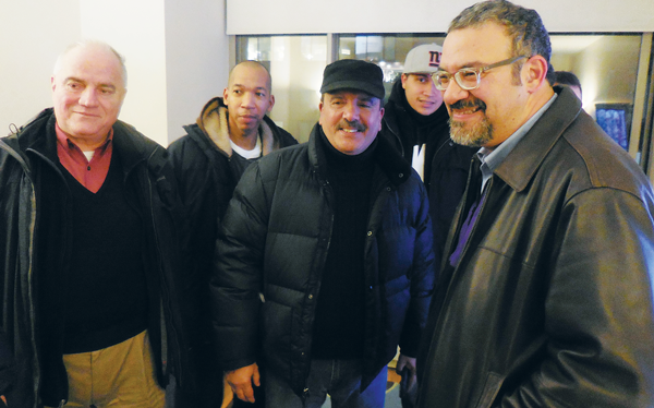 Photo by Eileen Stukane 32BJ President Hector Figueroa (far right, foreground) with members of his union, at the exhibit’s opening night. 