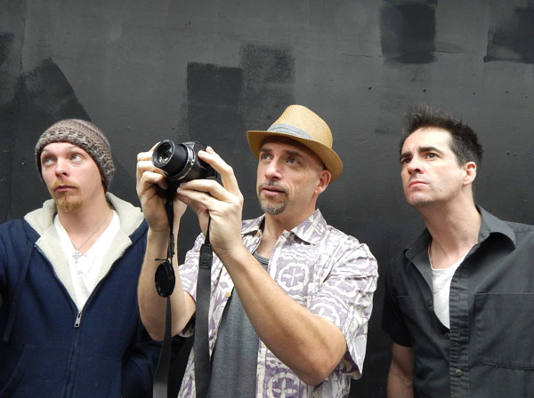 L to R: Paul Wallace as Oats, Scott McIntyre as Rick and Tom Ashton as Matt go plane spotting in “Butterfly Hour.”  Courtesy of The Textile Co.