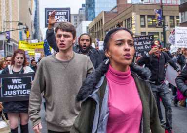 Shana-marching-in-Eighth-Avenue-north-of-intersection-with-W45-St