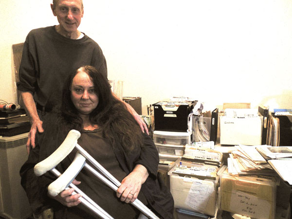 Cynthia Chaffee and her husband, Peter, inside their E. Sixth St. apartment, where she stores her voluminous files on her landlord, Steven Croman.   Photo by Gerard Flynn