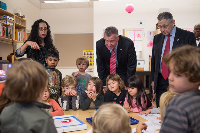 Photo courtesy of the Mayor’s Office.  Mayor Bill de Blasio last year at a pre-K event at Spruce Street School with Assemblymember Sheldon Silver, who was the Assembly’s speaker then. 