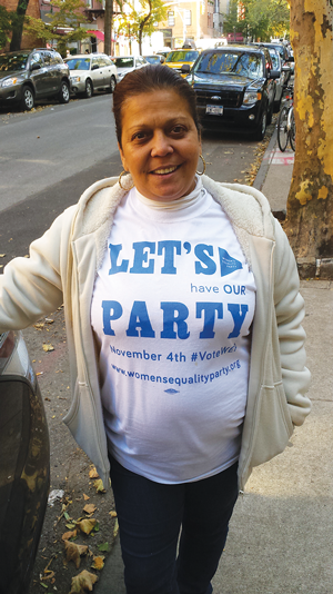 Eugenia Fiammetta, a poll worker at P.S. 41, said she voted for Cuomo on the Women’s Equality Party line. “Cuomo, No. 1, all the way!” she said, as she proudly wore a W.E.P. T-shirt. “I go based by family — I followed his father — and women’s rights. She grew up on E. 11th St., she said, “right next to Veniero’s.”   Photo by Lincoln Anderson