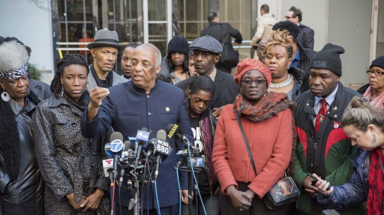 Charles Barron speaks during a news conference with Melissa Butler at the Office of the Brooklyn District Attorney in Brooklyn on Monday Nov. 24, 2014. Butler was with Akai Gurley when he was shot inside the stairwell.
