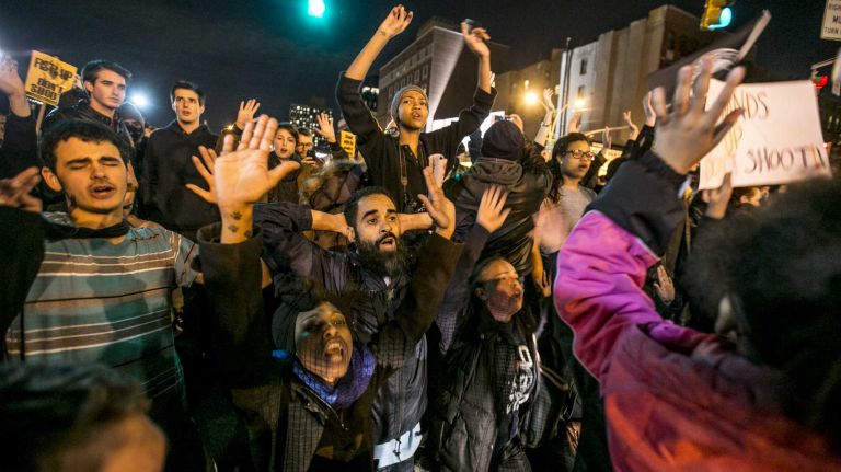 Protesters gather in Lower Manhattan on Tuesday, Nov. 25, 2014, in response to the grand jury decision regarding the fatal shooting of Michael Brown in Ferguson, Mo.