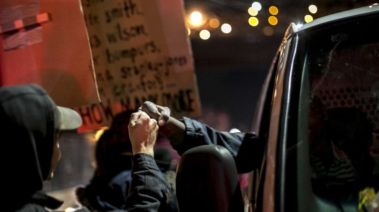 Protesters gather in Lower Manhattan on Tuesday, Nov. 25, 2014, in response to the grand jury decision regarding the fatal shooting of Michael Brown in Ferguson, Mo.