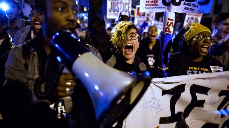 Protesters react in Manhattan on Monday, Nov. 24, 2014, after a grand jury decision declined to indict Ferguson Officer Darren Wilson, who shot and killed an unarmed Michael Brown in August, sparking violent protests in Ferguson, Mo.