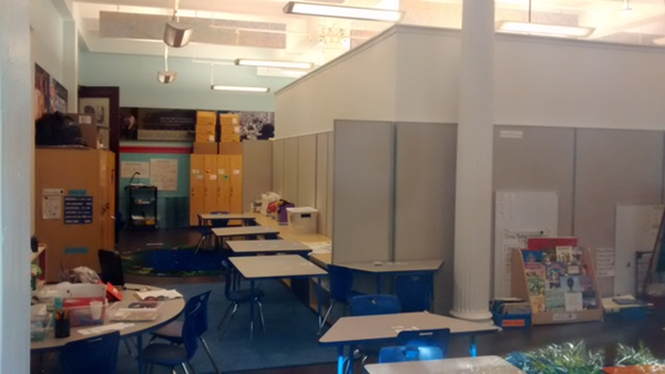 Taller dividers at Peck Slip School, but division remains 1 Photo courtesy of Peck Slip School PTA. The new taller dividers at Peck Slip School.