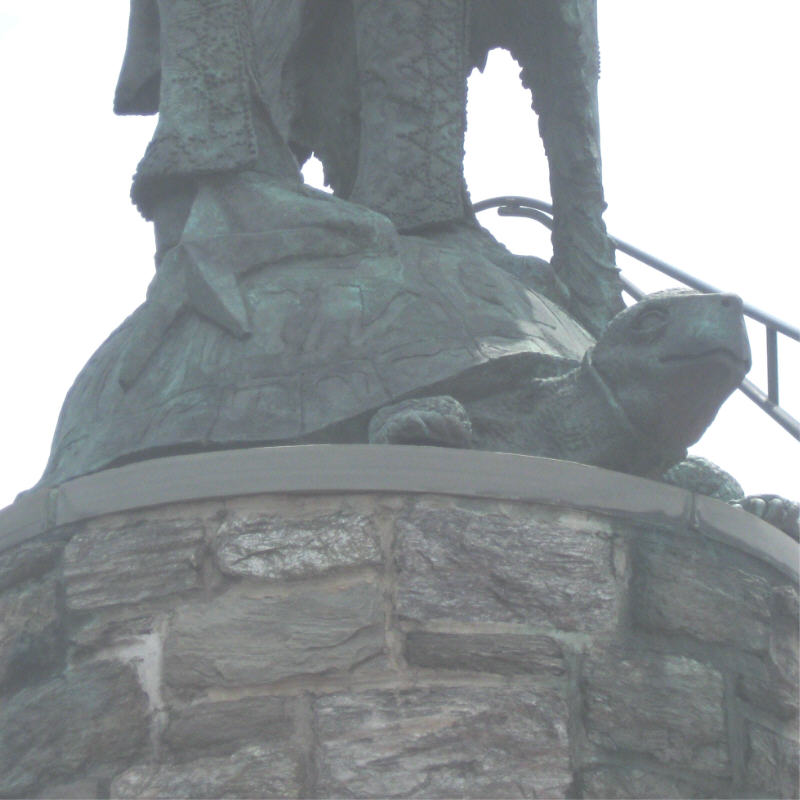 A closeup of Chief Tamanend’s feet atop a tortoise on a Philadelphia statue. A similar statue on the exterior of New York City's Tammany Hall was the inspiration for the terrapin roof design.