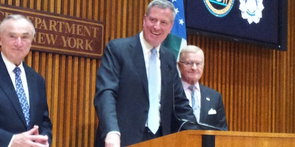 Mayor de Blasio said on his second day in office, Jan. 2, that the transition is going smoothly. William Bratton, left, his police commissioner, was sworon in that day, and Sanitation Commissioner John Doherty, right, gave an update on the coming snow storm. Downtown Express photo by Cynthia Magnus.  