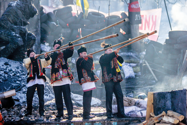 Members of the musical group the Koliadnyky (here, on the barricades in Kyiv in Feb. of 2014) are part of “Winter Light,” at La MaMa on Dec. 27 & 28.   Photo by Maksym Kudymets