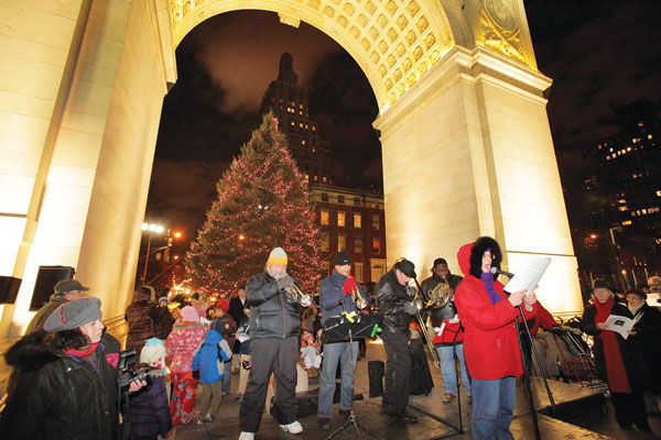 The Rob Susman Brass Quartet, and free songbooks, will make the season merry and bright (Dec. 10 & 24 at the Washington Square Park Arch).   Photo by Ken Howard