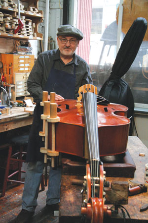 Downtown Express photo by Ellen Mandel Mike Weatherly, one of the craftsman at David Gage String Instrument Repair on Walker St. 