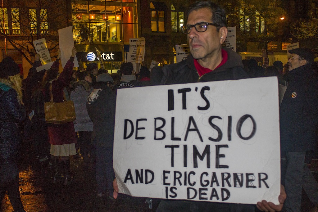 A crowd — including veteran activist Bill Dobbs of Soho, above— quickly formed at Union Square following the announcement that Officer Daniel Pantaleo was not indicted in the death of Eric Garner. By 5:30 p.m. about 250 people had assembled.