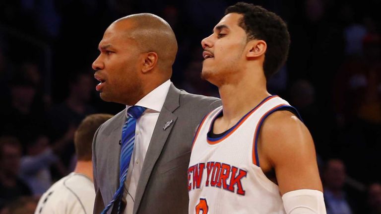 Head coach Derek Fisher of the New York Knicks with Shane Larkin after a missed shot late in a game against the Cleveland Cavaliers at Madison Square Garden on Thursday, Dec. 4, 2014.